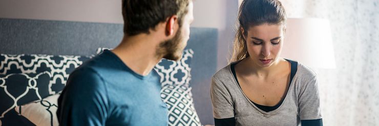 CENTOGENE Man and Woman Sitting on a Bed