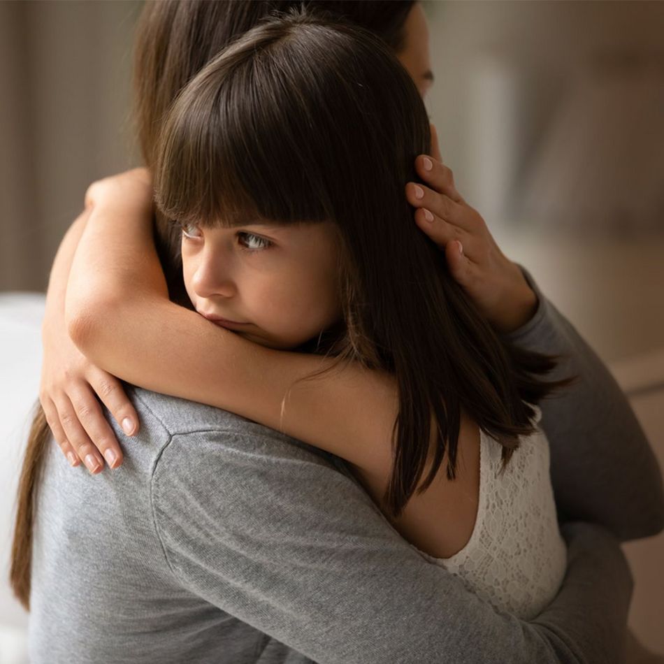 CENTOGENE Little Girl Hugged by Mother