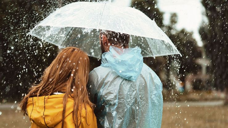 CENTOGENE People standing under umbrella in the rain